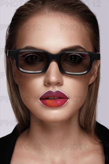 Beautiful caucasian woman with creative makeup and purple lips. Beauty face. Art makeup