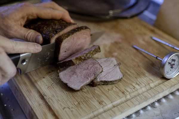 Beef roast is cut into pieces