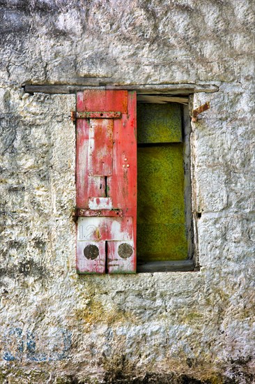 Half a wooden shutter painted red