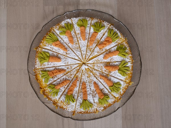 Homemade carrot cake on a glass plate