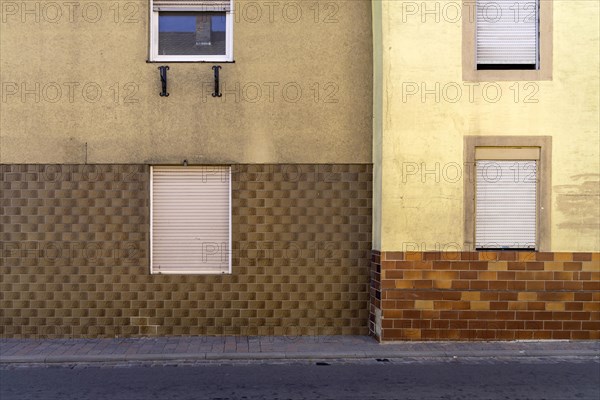 House facade with closed shutters