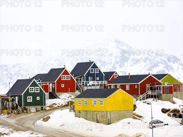 Colourful wooden houses in Tasiilaq in winter