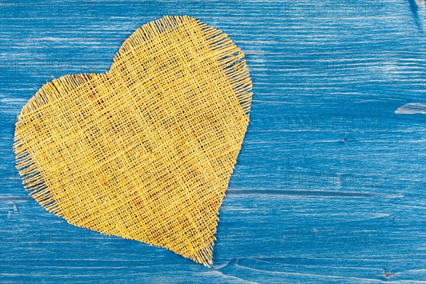 Linen heart on blue background