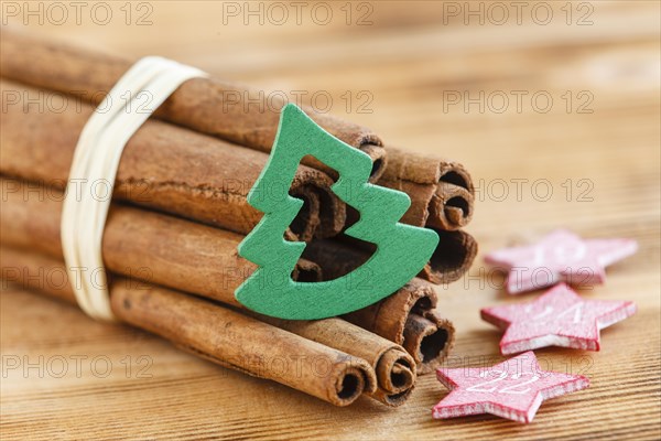 Cinnamon sticks with wooden fir tree