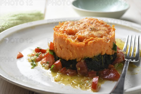 Sweet potatoes with kale served on a plate