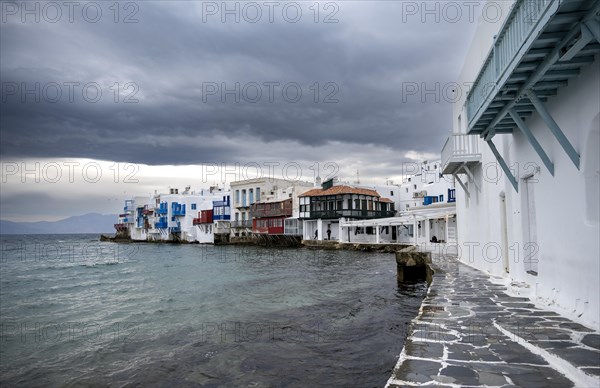 White Cycladic houses on the shore