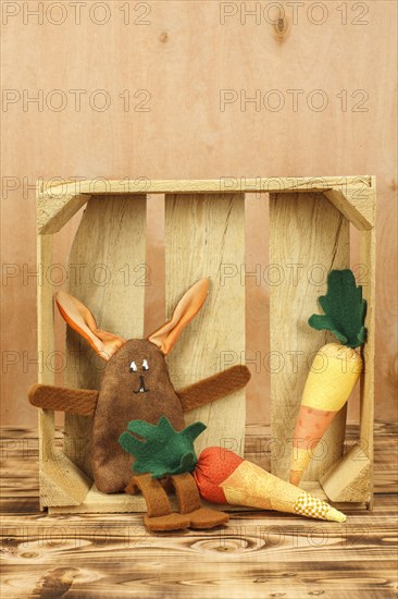 Stuffed bunny in wooden box