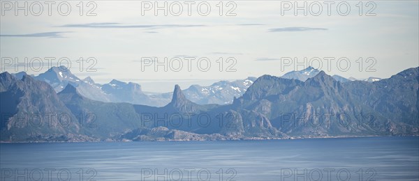 Pointed rocky mountains and sea