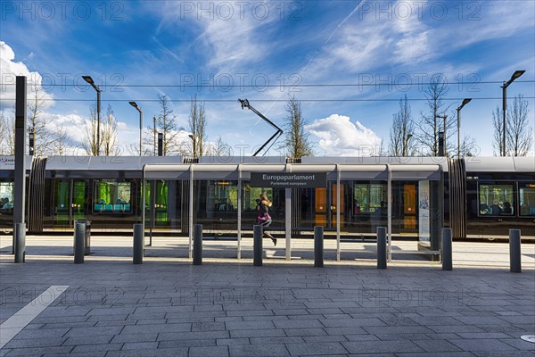 Pedestrian at tram stop