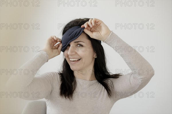 Happy woman with eye mask