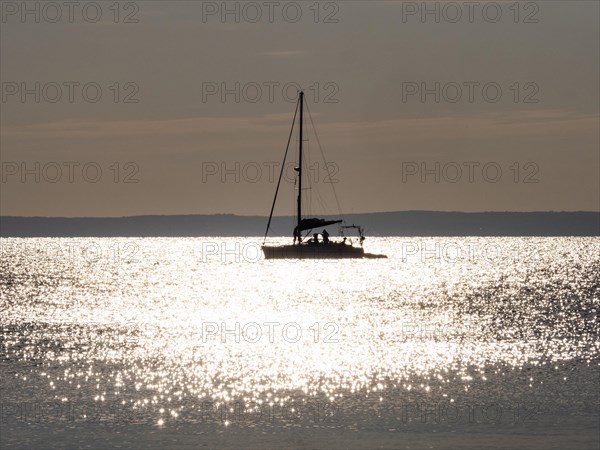 Sailing ship in the glittering sea