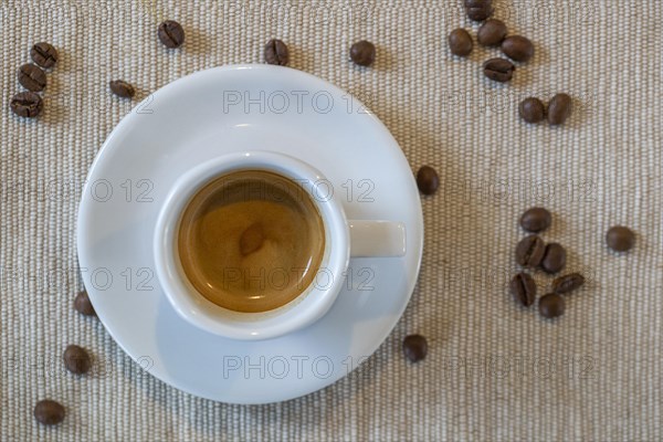 A cup filled with delicious espresso from above