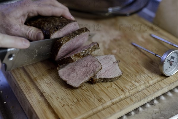 Beef roast is cut into pieces