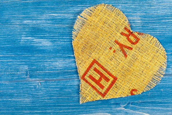 Linen heart on blue background