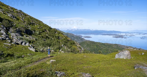 Hikers on trail to Dronningsvarden or Stortinden