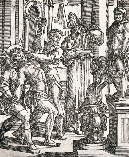 A torture victim is about to have his hand put into an open flame while a priest looks on
