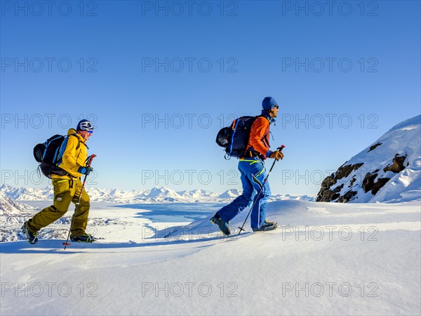 Climbers climb over ice on the local mountain