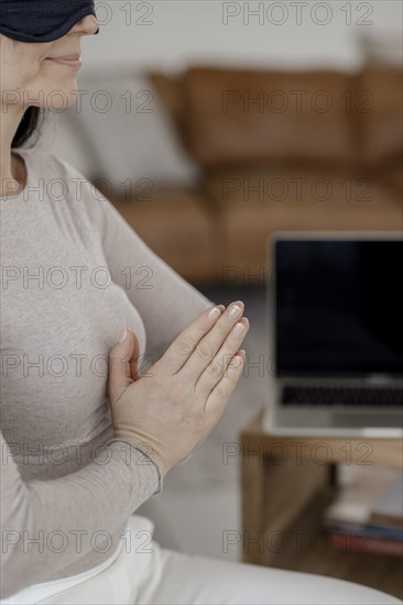 Woman sitting on chair doing a relaxation exercise