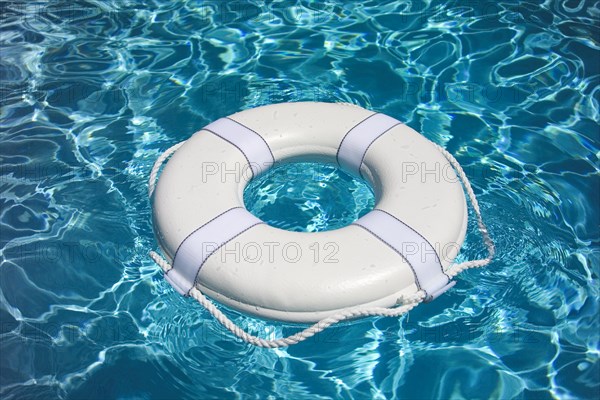 White life buoy in pool