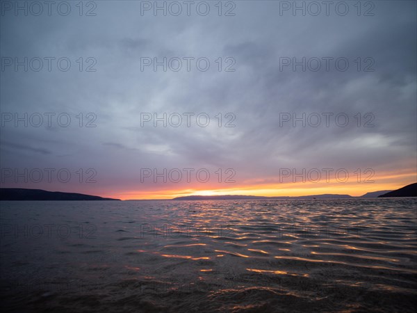 Evening glow over the sea after sunset