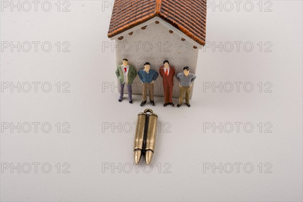 Men figurine model and Bullet as Conceptual against war photography
