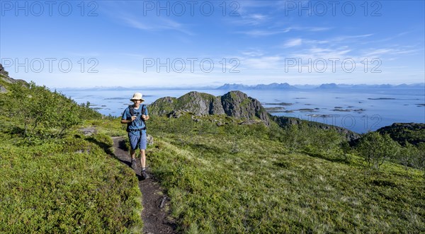 Hikers on trail to Dronningsvarden or Stortinden