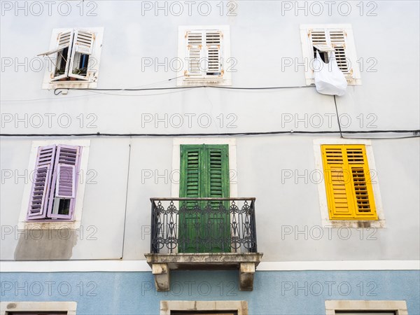 House facade with colourful shutters