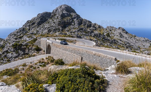 Car on mountain road with many curves to Sa Colobra