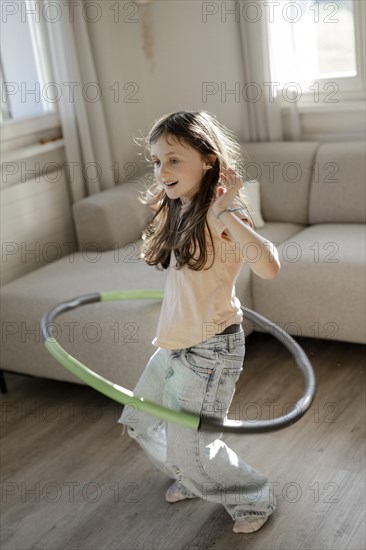 Girl gymnastics with hula hoop