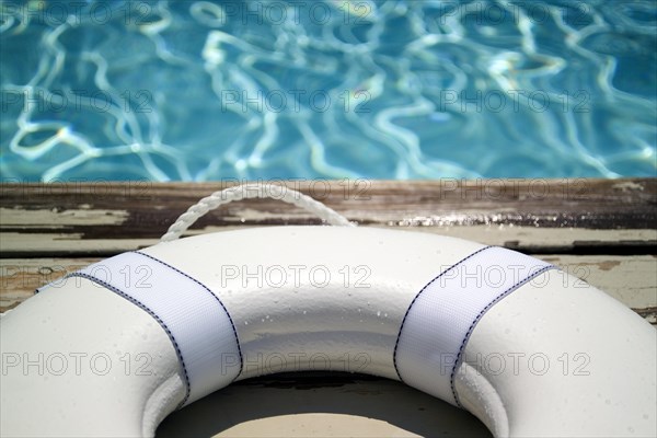 White life buoy on pool deck