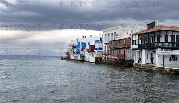 White Cycladic houses on the shore