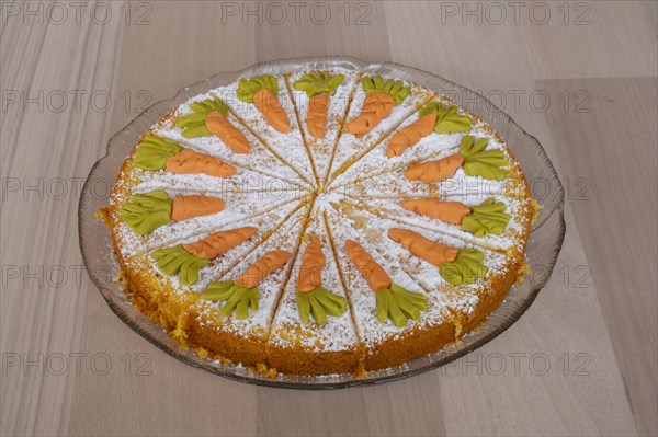 Homemade carrot cake on a glass plate