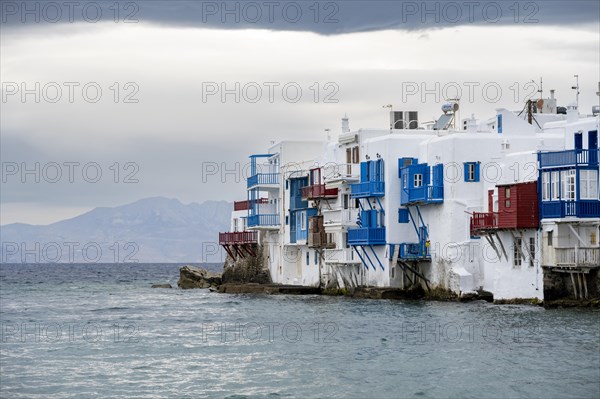 White Cycladic houses on the shore