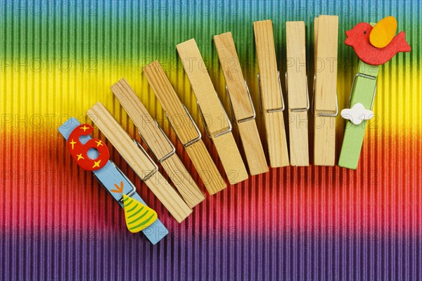 Clothes pegs and number 6