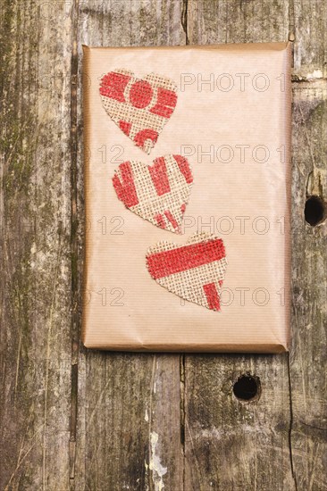 Wooden background with a gift