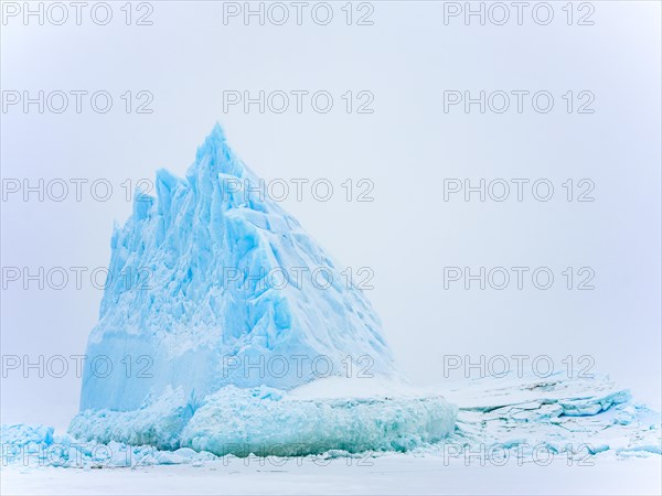 Iceberg in the frozen Kong Oscar Fjord