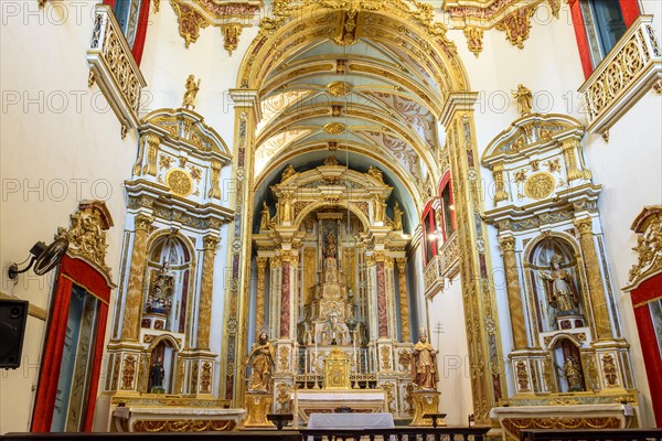 Golden altar of the church of Sao Pedro dos Clerigos created in the 18th century with its neoclassical style interior painted in gold in the Pelourinho neighborhood of Salvador