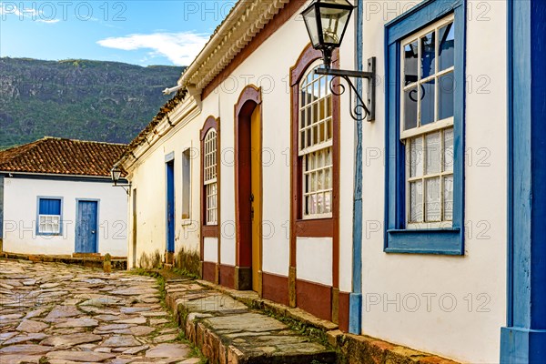 Cobblestone street and facade of old colonial style colorful houses in the historic city of Tiradentes in Minas Gerais