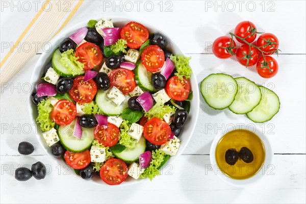 Greek salad with fresh tomatoes olives and feta cheese healthy eating food from above on wooden board in Stuttgart