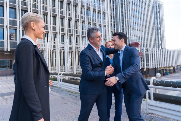 Successful Business Leaders Shaking Hands in Modern Cityscape