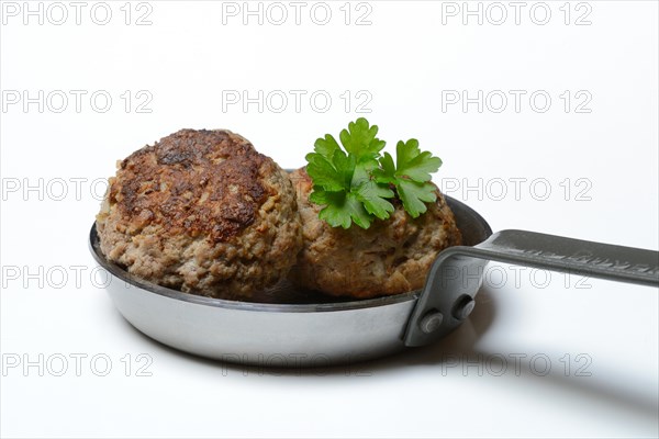 Homemade meatballs in pans