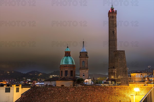 The leaning towers Garisenda and Asinelli with the church Santi Bartolomeo and Gaetano in the historic centre