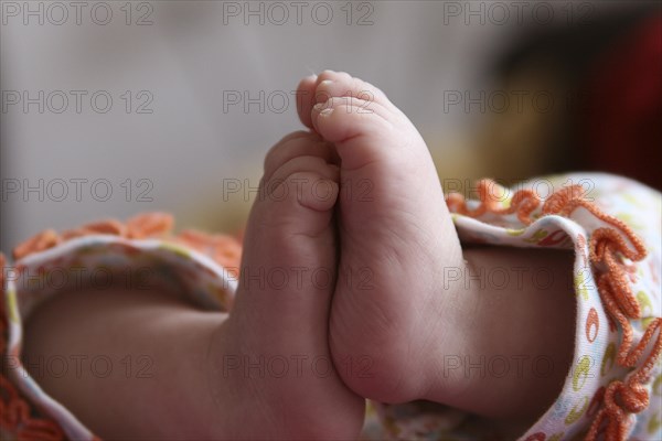 Close-up of two baby feet of a newborn child