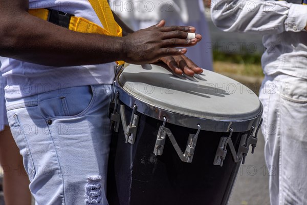 Atabaque drum player in the streets of Brazil during brazilian samba presentation