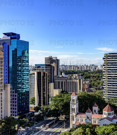 View of the modern city of Sao Paulo and its buildings forming a wall of buildings in the background on a sunny day