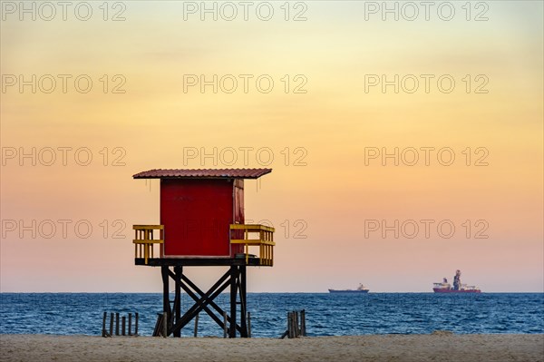 Rescue cabin on Copacabana beach at a tropical sunset on Rio de Janeiro city