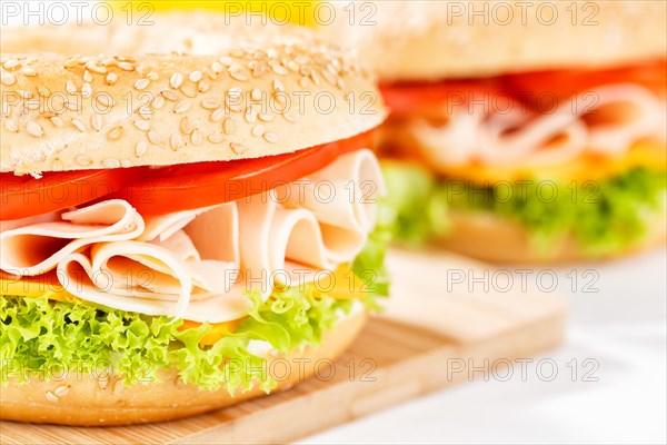 Bagel sandwich for breakfast topped with chicken ham close-up in Stuttgart