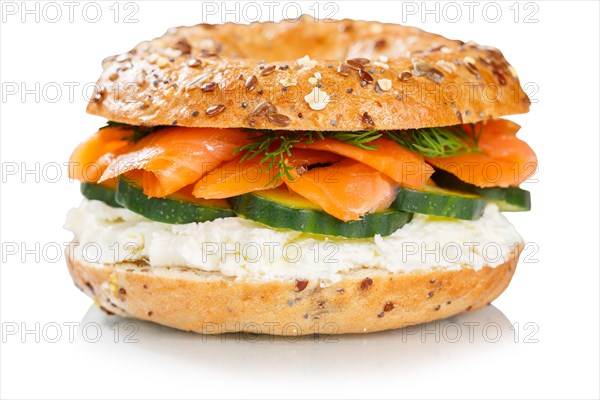 Bagel roll topped with salmon fish sandwich for breakfast set against a white background in Stuttgart