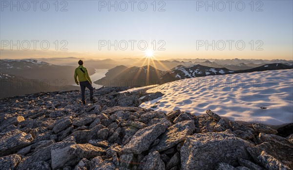 Hiker looking into the sunset