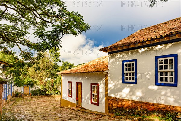 Cobbled street and colorful colonial-style houses at evening on the old and historic city of Tiradentes in Minas Gerais